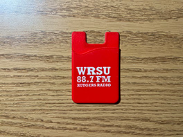 A bright red Rutgers Radio phone card sleeve
