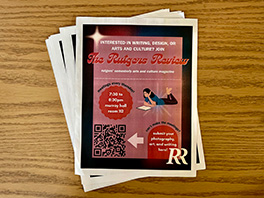 A pile of brightly colored flyers for the Rutgers Review, an arts and culture magazine
