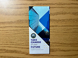 A blue US Navy pamphlet with the phrase 'TAKE CHARGE of your FUTURE'